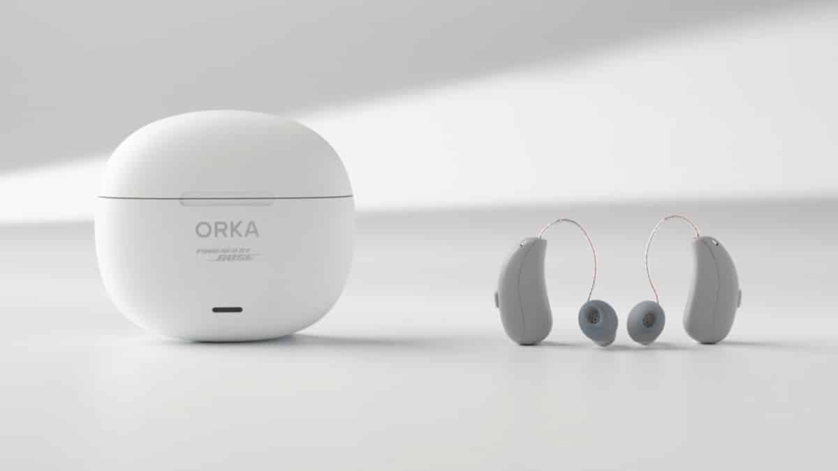 Orka O1 Pro receiver-in-canal (RIC) hearing aids and charger.